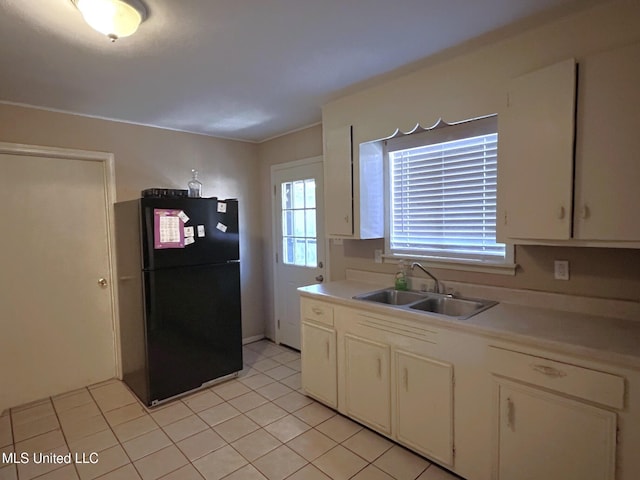 206 Shields Ave, Pelahatchie, MS 39145 - kitchen featuring freestanding refrigerator, a sink, light countertops, and white cabinets