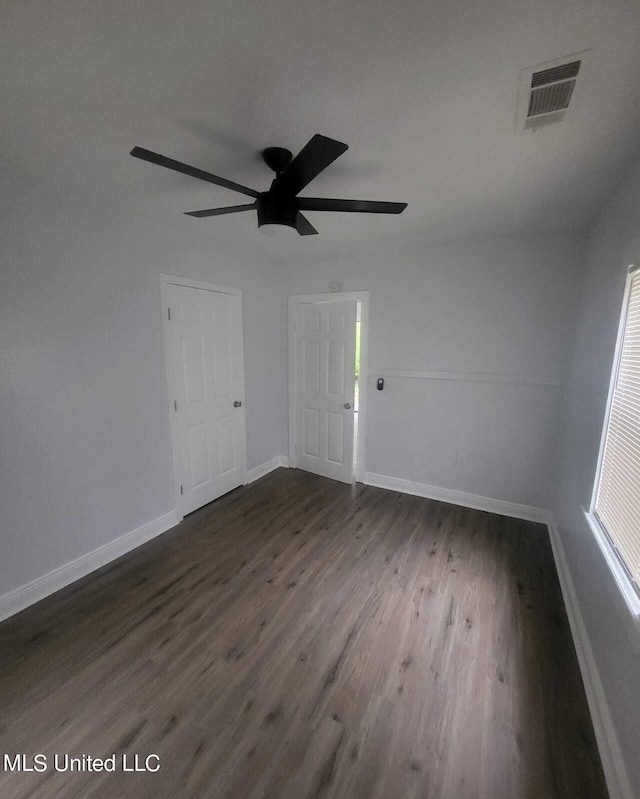 4222 Chennault Ave, Jackson, MS 39209 - unfurnished room featuring dark wood finished floors, baseboards, and ceiling fan
