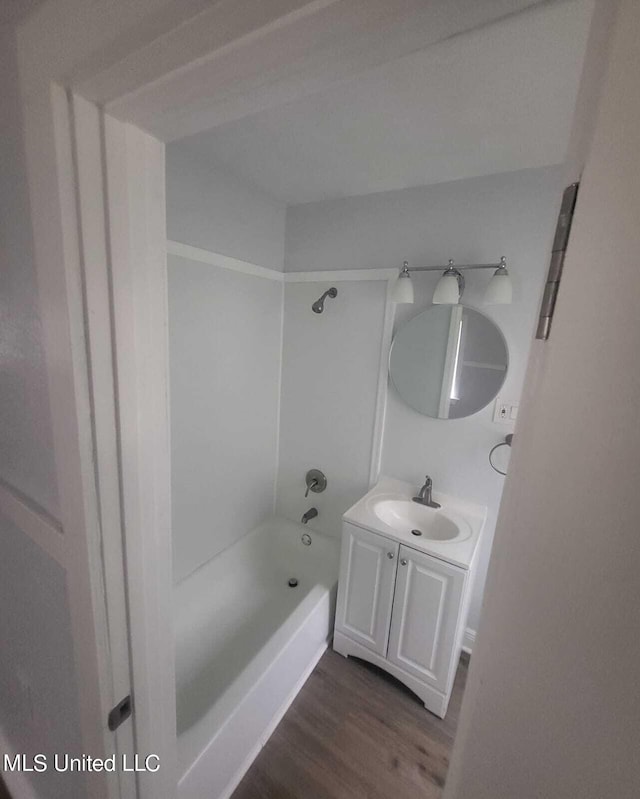 4222 Chennault Ave, Jackson, MS 39209 - full bath with vanity, wood finished floors, and tub / shower combination