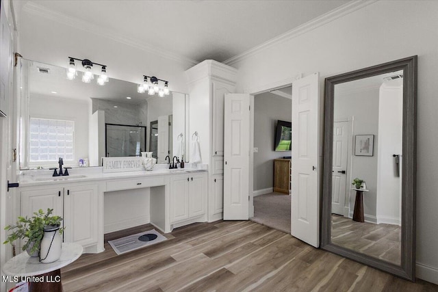 136 S Cypress Lake Blvd, Madison, MS 39110 - bathroom featuring double vanity, crown molding, wood finished floors, and a stall shower
