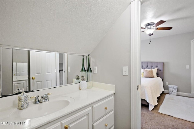 136 S Cypress Lake Blvd, Madison, MS 39110 - bathroom with vanity, a textured ceiling, ceiling fan, ensuite bath, and lofted ceiling