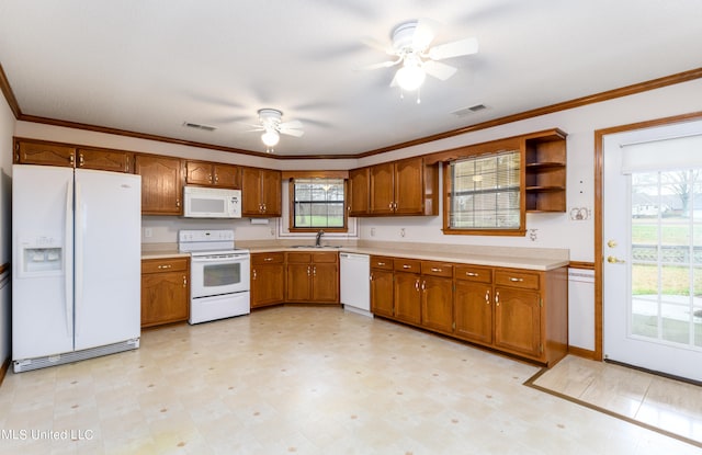 kitchen with sink, crown molding, white appliances, and ceiling fan