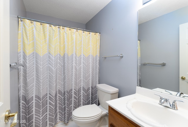 bathroom featuring toilet, a textured ceiling, a shower with curtain, and vanity