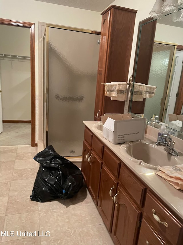 bathroom featuring vanity and walk in shower