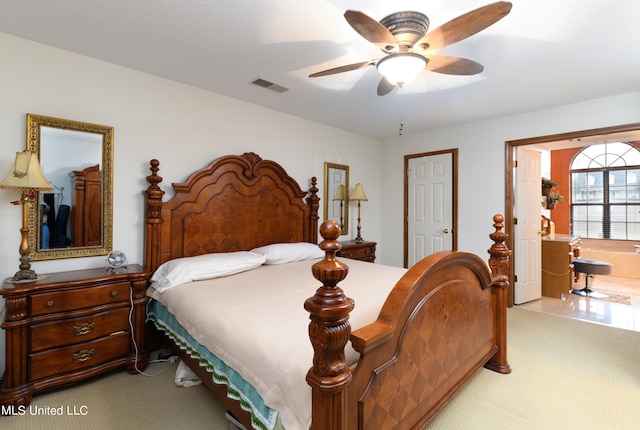 bedroom featuring ceiling fan and light carpet