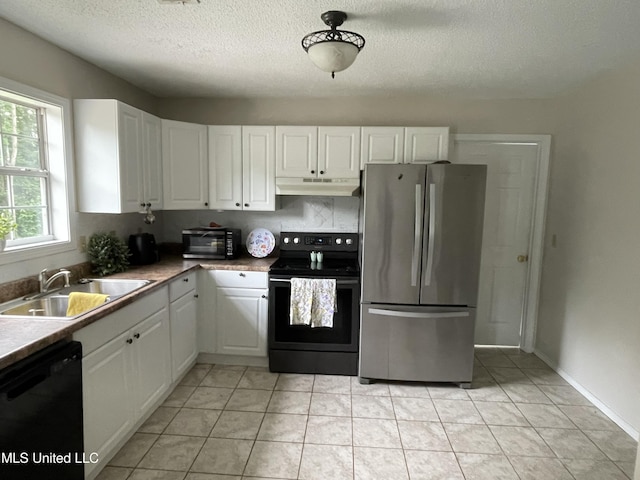 11319 Wren Rd, Hernando, MS 38632 - kitchen with black appliances, under cabinet range hood, white cabinetry, a textured ceiling, and light tile patterned floors