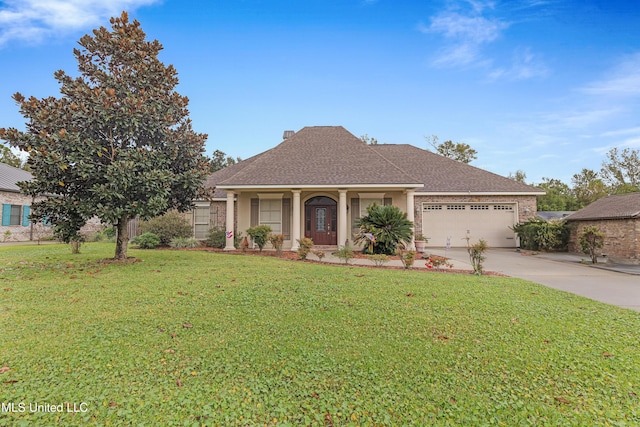 136 Sea Oaks Blvd, Long Beach, MS 39560 - view of front of home featuring a garage, concrete driveway, a front lawn, and roof with shingles