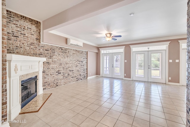 136 Sea Oaks Blvd, Long Beach, MS 39560 - unfurnished living room featuring french doors, brick wall, ornamental molding, light tile patterned flooring, and a ceiling fan