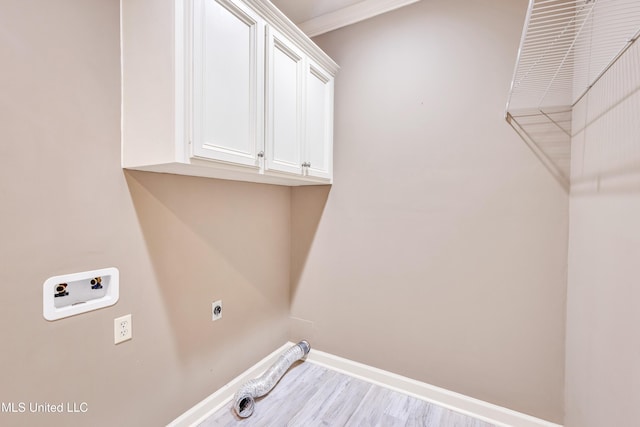 136 Sea Oaks Blvd, Long Beach, MS 39560 - laundry area with cabinet space, hookup for a washing machine, wood finished floors, electric dryer hookup, and ornamental molding