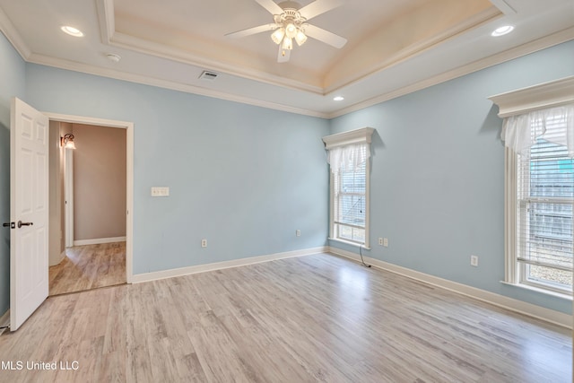136 Sea Oaks Blvd, Long Beach, MS 39560 - spare room with healthy amount of natural light, a tray ceiling, ornamental molding, and recessed lighting