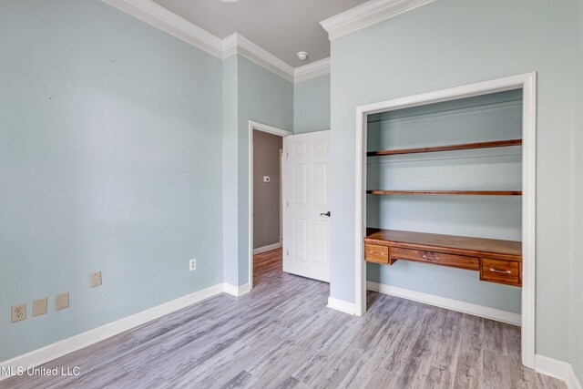 136 Sea Oaks Blvd, Long Beach, MS 39560 - unfurnished bedroom featuring ornamental molding, wood finished floors, and a closet