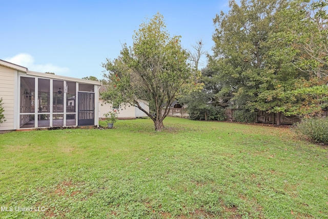 view of yard with a sunroom