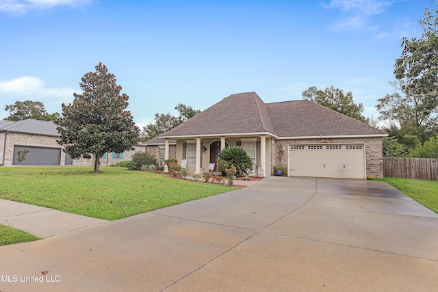 view of front of house featuring a front lawn and a garage