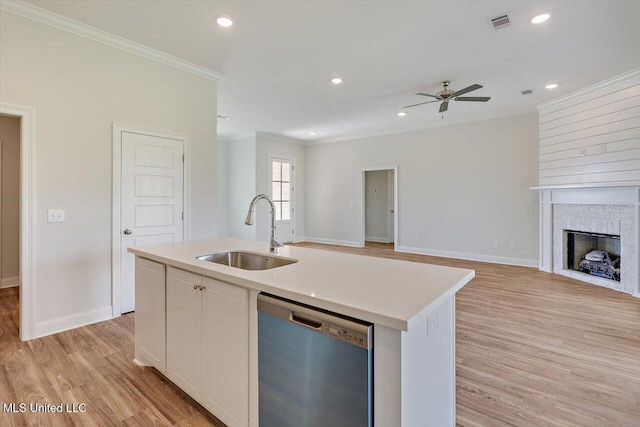 421 Baleigh Way, Canton, MS 39046 - kitchen featuring stainless steel dishwasher, a sink, ornamental molding, light wood-type flooring, and open floor plan