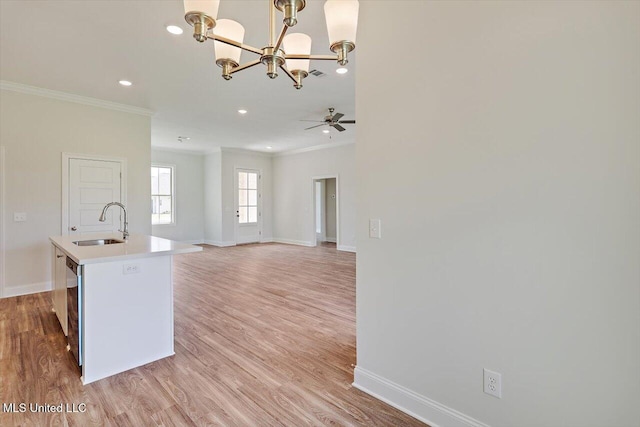 421 Baleigh Way, Canton, MS 39046 - kitchen featuring ornamental molding, a chandelier, baseboards, a sink, and light wood-style floors