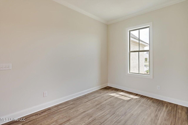 421 Baleigh Way, Canton, MS 39046 - spare room featuring light wood-style flooring, ornamental molding, and baseboards