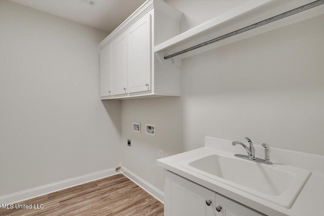 421 Baleigh Way, Canton, MS 39046 - laundry room featuring washer hookup, electric dryer hookup, cabinet space, light wood-style floors, and baseboards