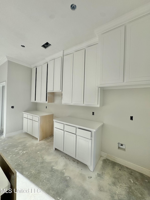 421 Baleigh Way, Canton, MS 39046 - laundry room featuring crown molding and baseboards