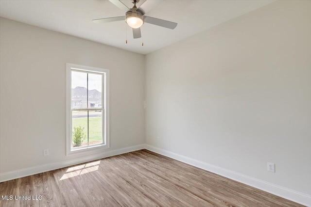 421 Baleigh Way, Canton, MS 39046 - empty room with light wood finished floors, baseboards, and a ceiling fan
