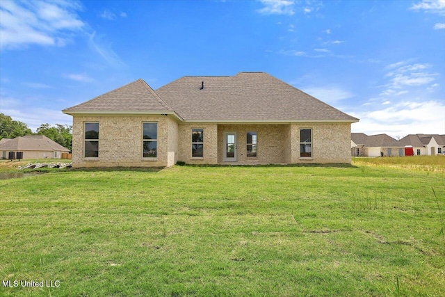 421 Baleigh Way, Canton, MS 39046 - rear view of property featuring a yard and a shingled roof
