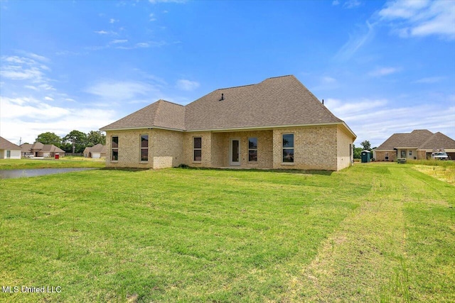 421 Baleigh Way, Canton, MS 39046 - back of property with a lawn, a shingled roof, and brick siding