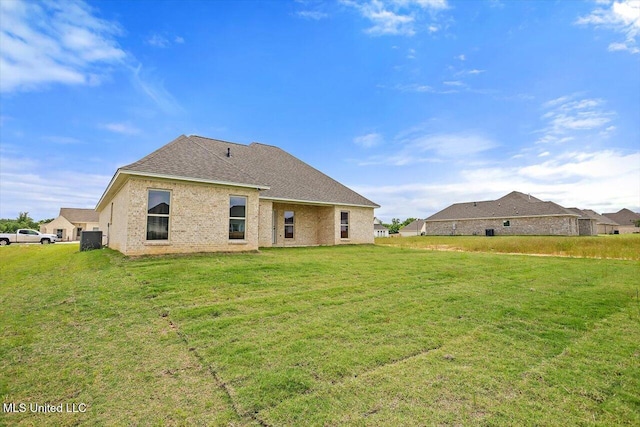 421 Baleigh Way, Canton, MS 39046 - rear view of property featuring a lawn, cooling unit, a shingled roof, and brick siding