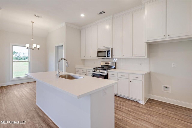 421 Baleigh Way, Canton, MS 39046 - kitchen with stainless steel appliances, a sink, baseboards, light wood-style floors, and recessed lighting