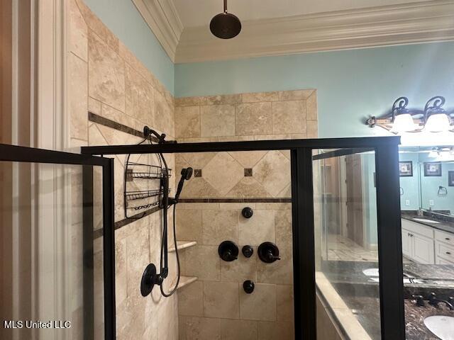 113 Hastings Ave, Brandon, MS 39042 - bathroom view of crown molding, tiled shower, and vanity