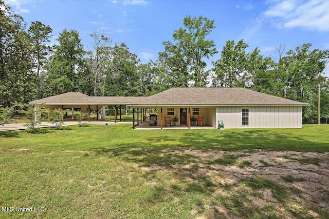3341 Simpson Highway 13, Mendenhall, MS 39114 - rear view of property with a lawn, a patio, view of scattered trees, and a carport