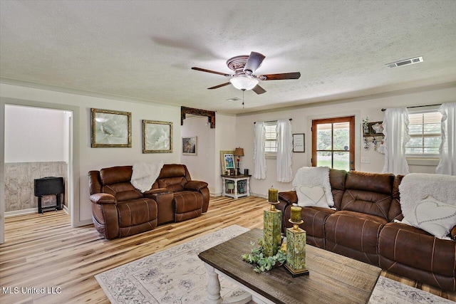 3341 Simpson Highway 13, Mendenhall, MS 39114 - living area with a textured ceiling, light wood-style floors, ceiling fan, and baseboards