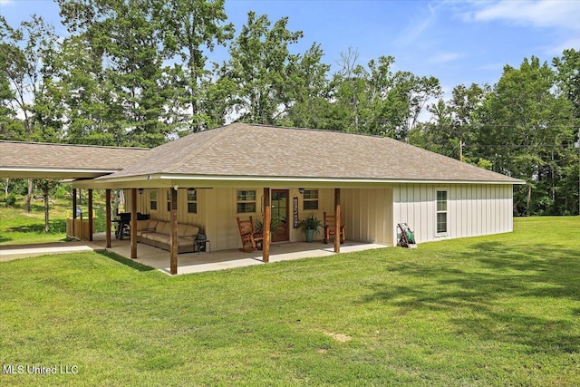 3341 Simpson Highway 13, Mendenhall, MS 39114 - back of property with roof with shingles, a yard, a patio, and board and batten siding