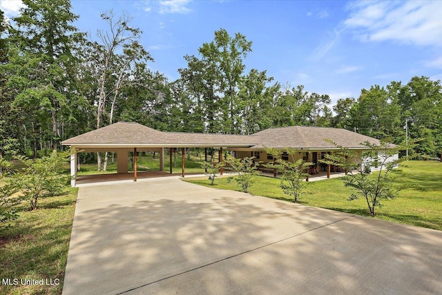 3341 Simpson Highway 13, Mendenhall, MS 39114 - view of home's community featuring a carport, concrete driveway, and a lawn