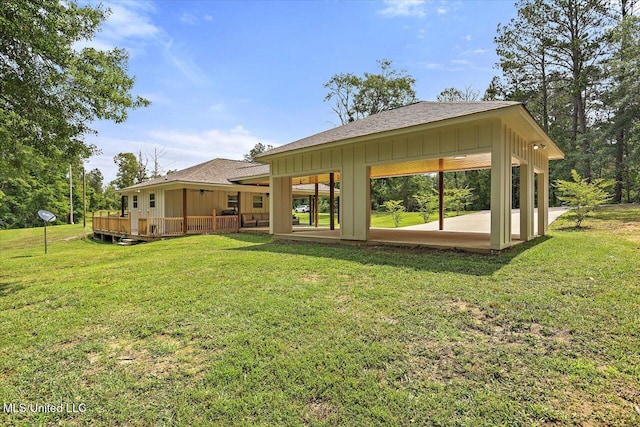 3341 Simpson Highway 13, Mendenhall, MS 39114 - back of house with a yard, a shingled roof, board and batten siding, and a patio
