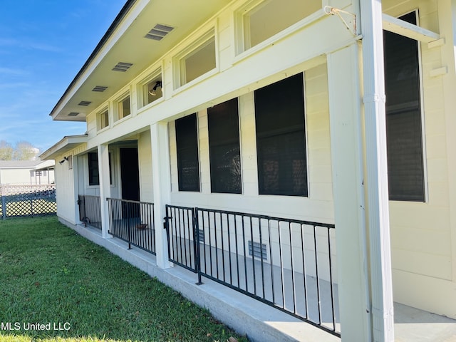 view of property exterior with a yard