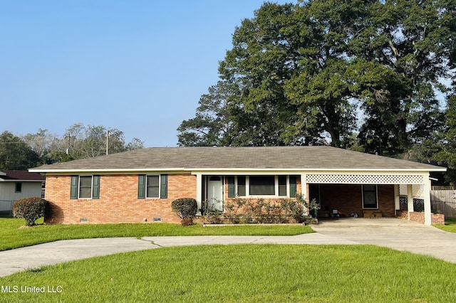 ranch-style house featuring a front yard and a carport