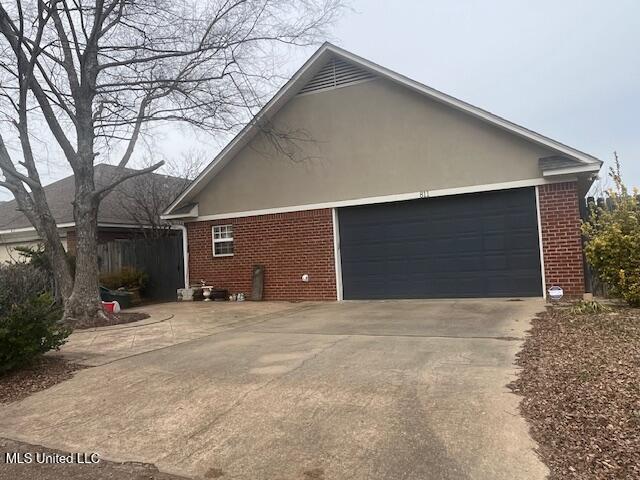 view of property exterior with a garage