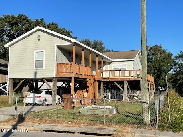 rear view of house with a carport