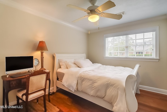 bedroom featuring crown molding, dark wood-type flooring, and ceiling fan