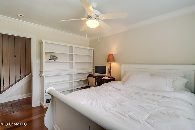 bedroom featuring ceiling fan, ornamental molding, and dark hardwood / wood-style floors