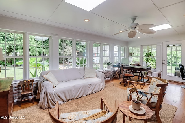 sunroom / solarium featuring ceiling fan