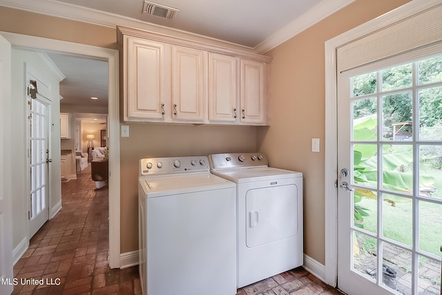 1 Bayou View Dr, Gulfport, MS 39507 - clothes washing area featuring washing machine and clothes dryer, cabinet space, ornamental molding, baseboards, and brick patterned floors