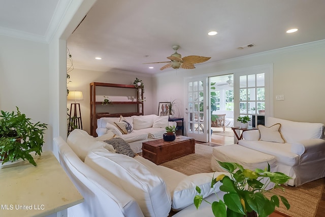 living room featuring crown molding and ceiling fan