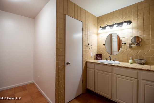 204 Trautman Ave, Long Beach, MS 39560 - bathroom with tile patterned flooring, vanity, tile walls, and decorative backsplash