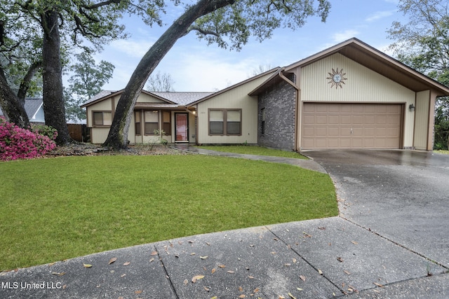 2804 Oakridge Cir, Gulfport, MS 39507 - view of front of home featuring asphalt driveway, a front yard, and an attached garage