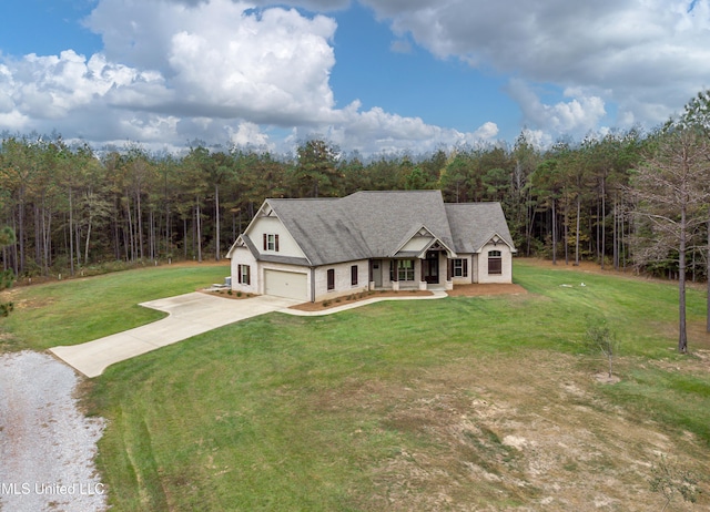 view of front of house featuring a front lawn and a garage