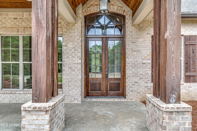 view of exterior entry featuring french doors