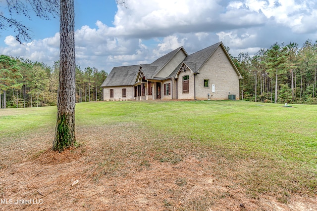 french provincial home with central AC and a front lawn