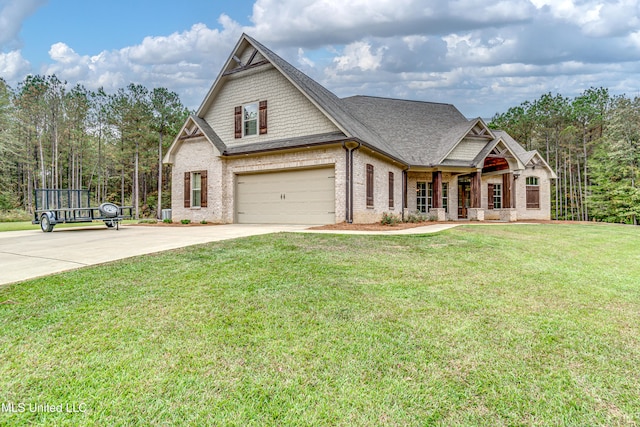 craftsman-style house featuring a garage and a front yard