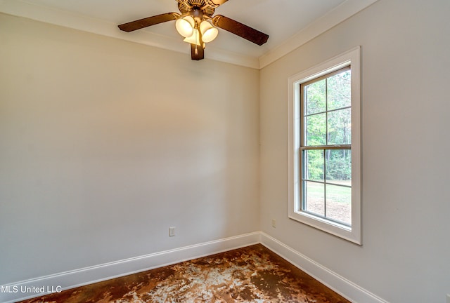 unfurnished room with ceiling fan and ornamental molding