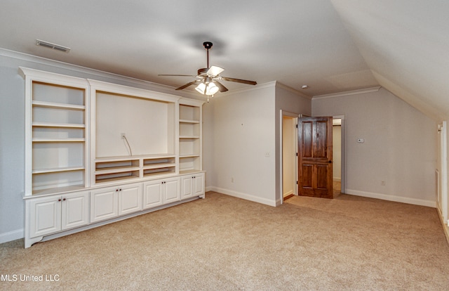 unfurnished living room featuring built in features, ornamental molding, light carpet, vaulted ceiling, and ceiling fan